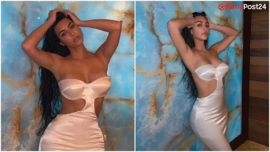 Kim Kardashian is a Seductress in Her White Satin Off-Shoulder Dress (View Pics)